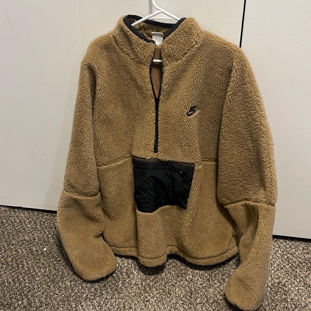 Nike 1/4 zip fleece hoodie with black detailing.